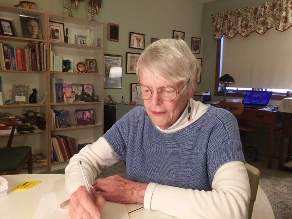 Woman sitting at desk in home