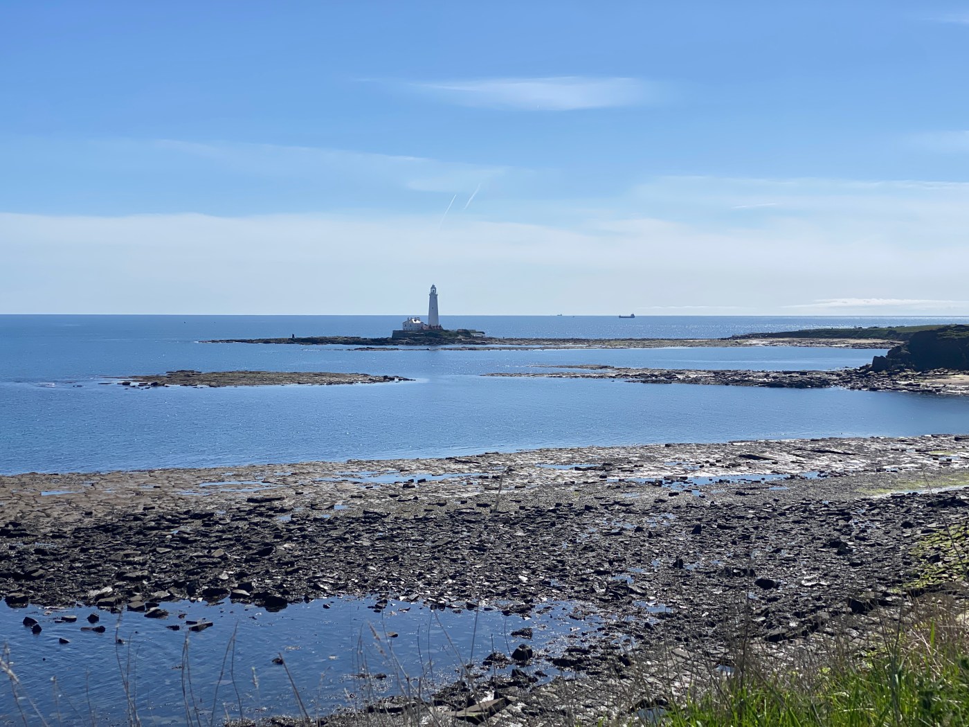 Sea with lighthouse on island