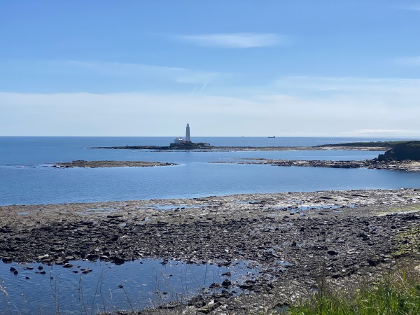 Sea with lighthouse on island