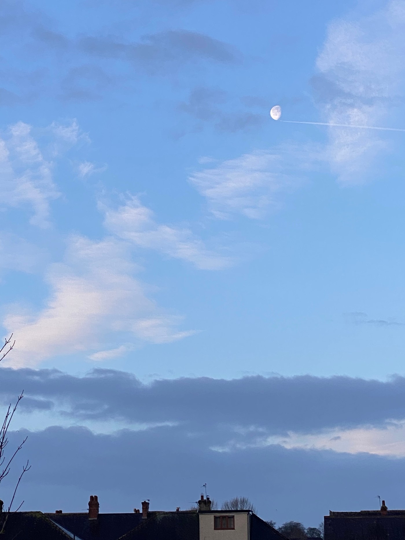 Moon with plane flying below